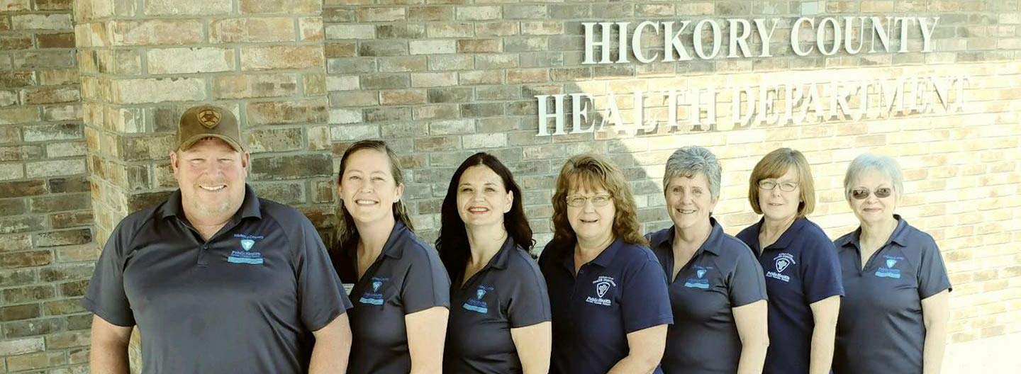 home-hero-staff-and-new-place staff and new building